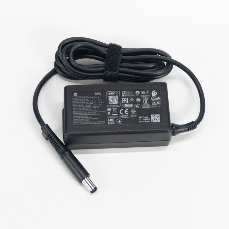 Etiqueta de cargador hp 65w 